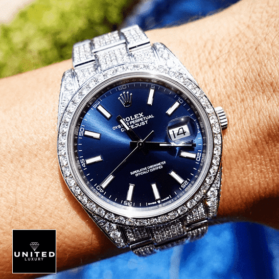 Rolex Datejust 126300 Rolex Datejust 126300 Blue Dial with white Stick Iced Out Replica on his arm