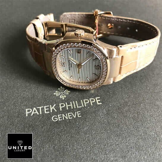 Patek Philippe Nautilus 7010R-011 Patek Philippe 7010 Diamond Bezel Leather Bracelet Replica on the grey carpet