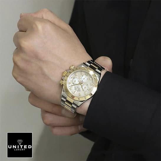 Rolex Daytona Two-Tone 116523 Rolex Daytona Two Tone White Dial 116523 Oyster Replica on his arm