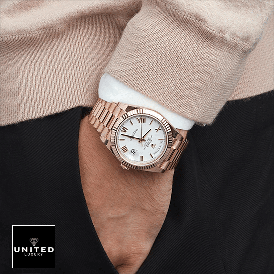 Rolex Day-Date 228235 Rose Gold Replica on is arm