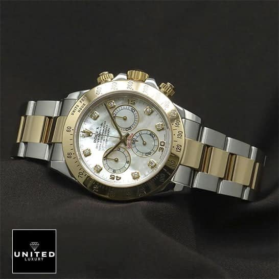 Rolex Daytona Two-Tone 116523 Rolex Daytona Two Tone White Dial 116523 Replica on the black table