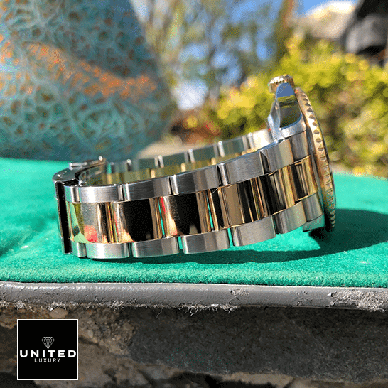 Rolex Submariner 16613 Rolex Submariner 16613 Serti Two Tone Stainless Steel Gold Diamond Replica on the table