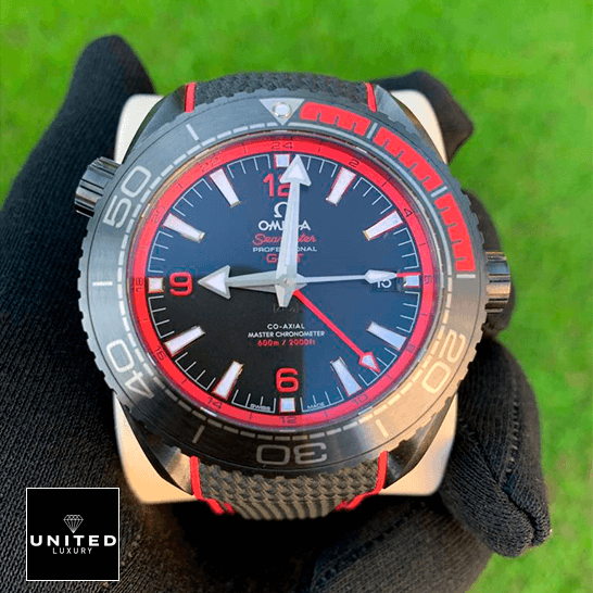 Omega Seamaster Planet Ocean Co-Axial Master Chronometer 215.92.46.22.01.003 Omega Seamaster 215_92_46_22_01_0_3 Black Dial Replica on the hand grass background