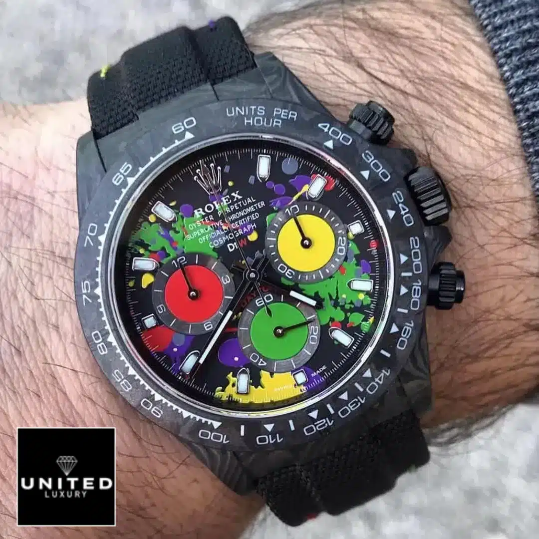 Rolex Daytona Rolex Daytona Carbon Rainbow Dial Black Button & Crown Pusher 4130cr Replica on his arm