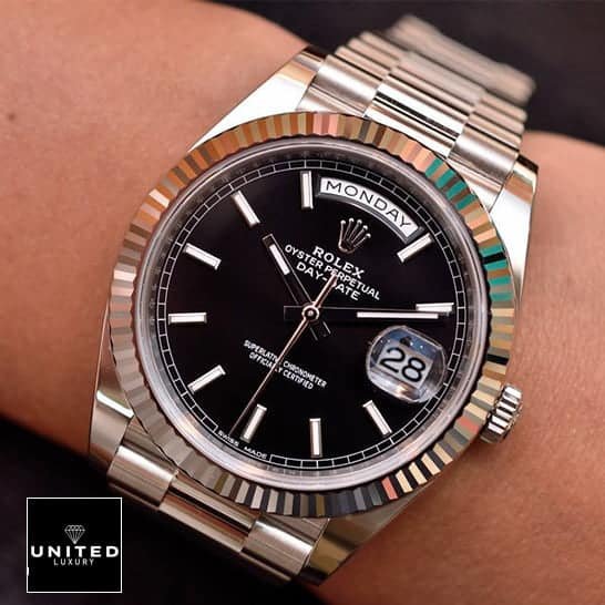 Rolex Day-Date 228238 Rolex Day-Date 118239 Black Dial Replica on his arm