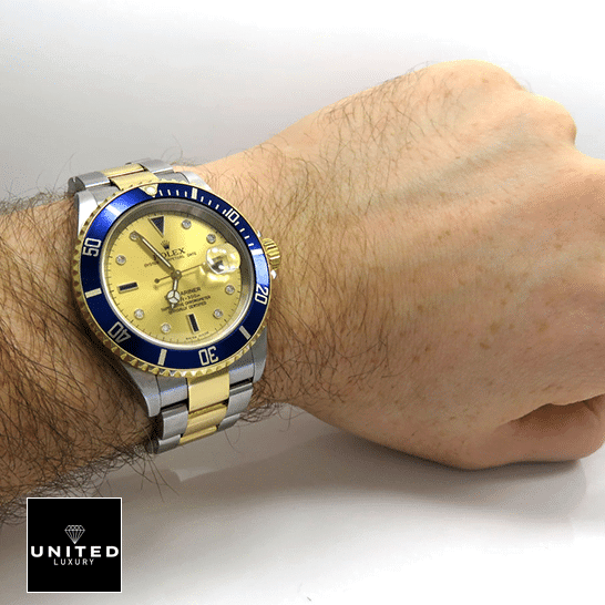 Rolex Submariner 16613 Rolex Submariner 16613 Two Tone Stainless Steel Gold Diamond Dial Replica on his arm