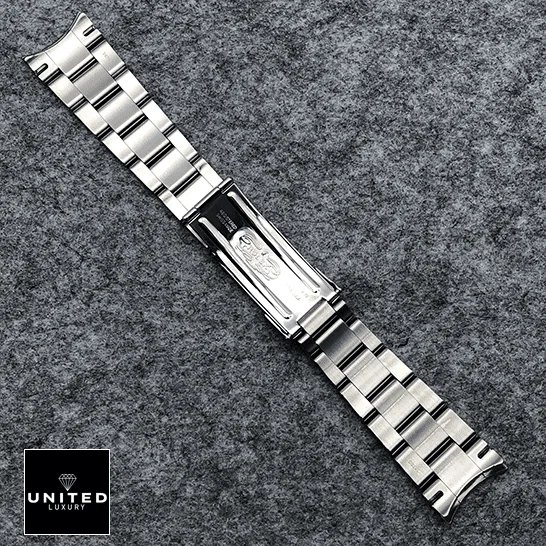 Rolex Datejust 114300 Oyster Perpetual Rolex Datejust Perpetual 114300 Replica Stainless Steel Fold Clasp Bracelet on the table